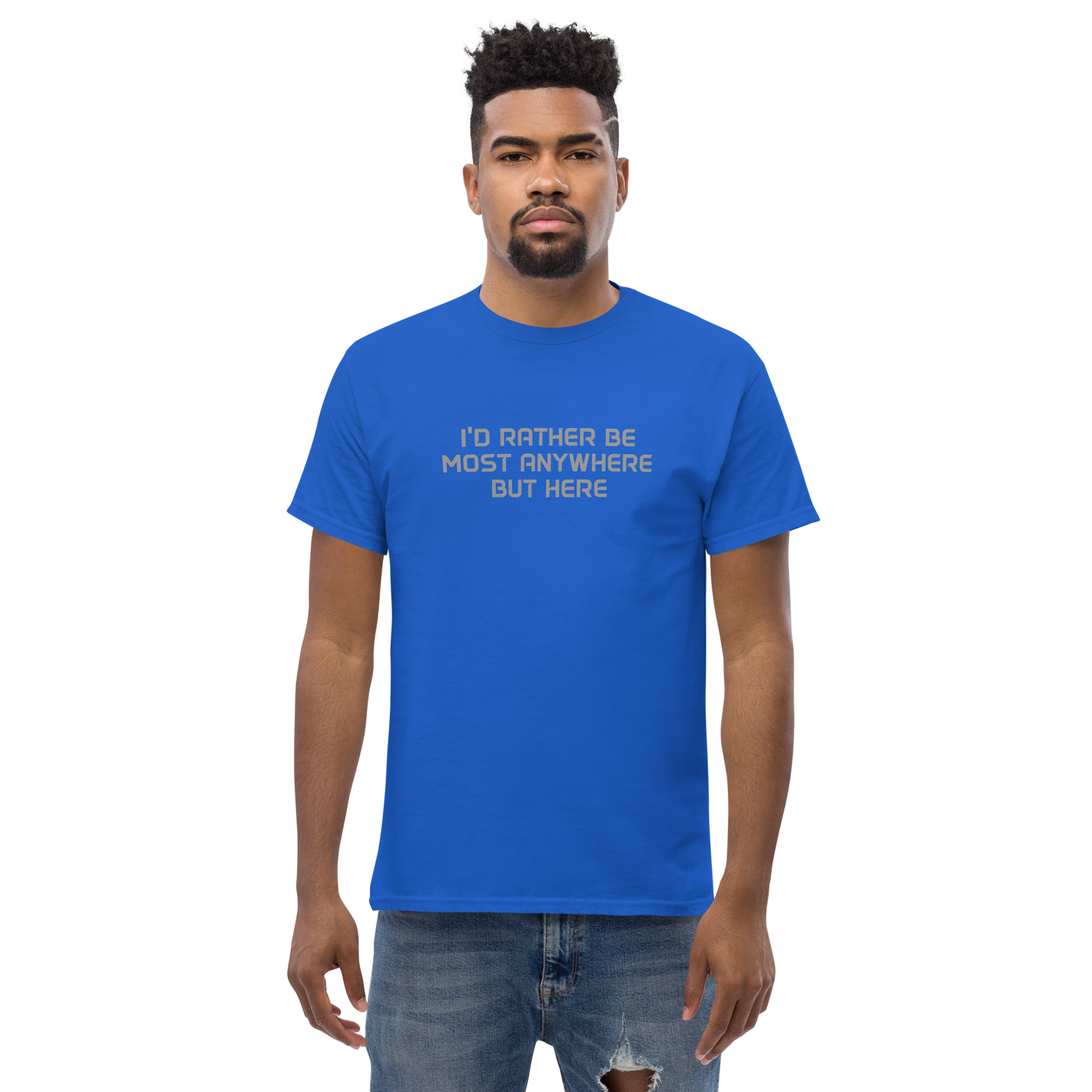 "I’d rather be most anywhere but here" printed on a royal unisex classic tee worn by a male