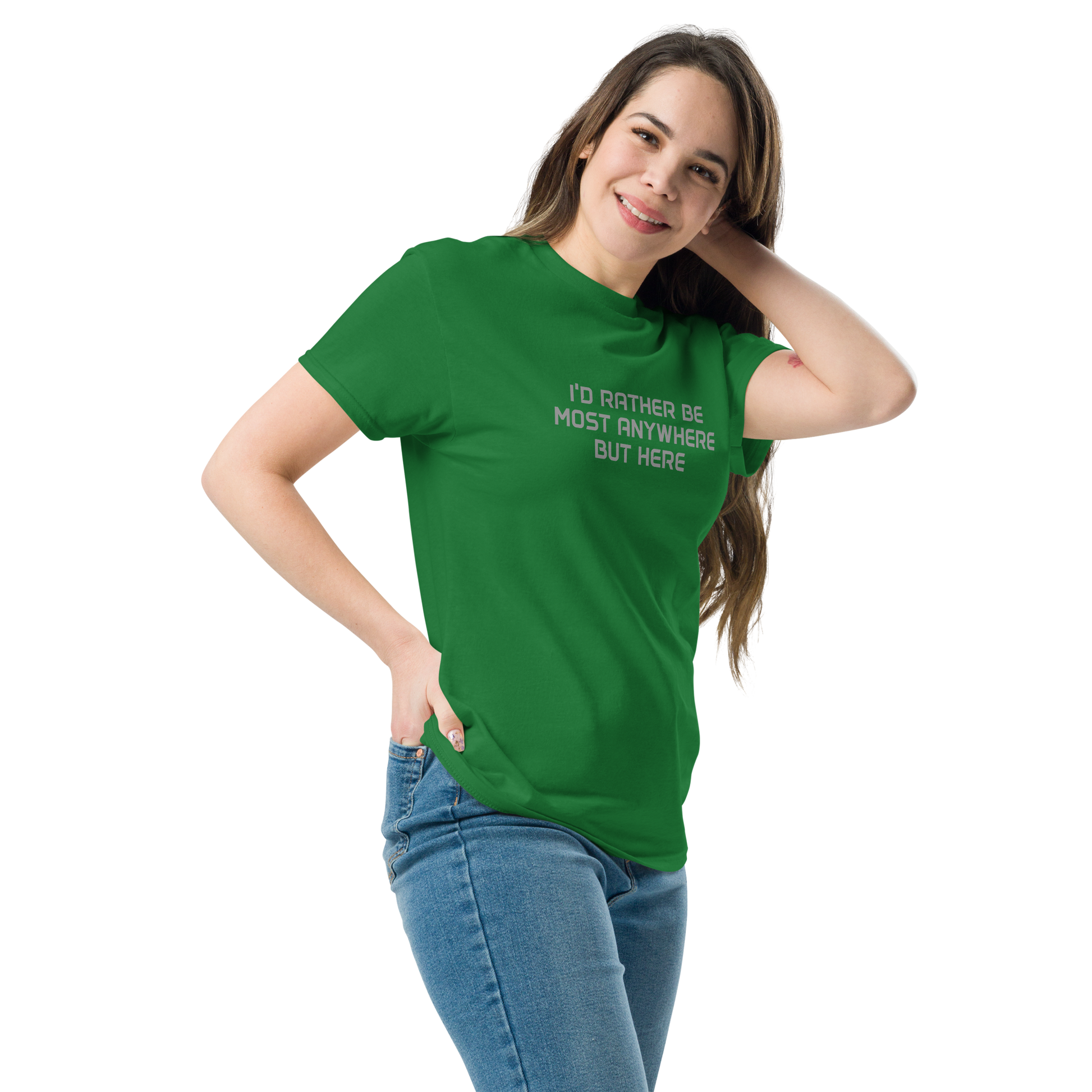 "I’d rather be most anywhere but here" printed on a turf green unisex classic tee worn by a female