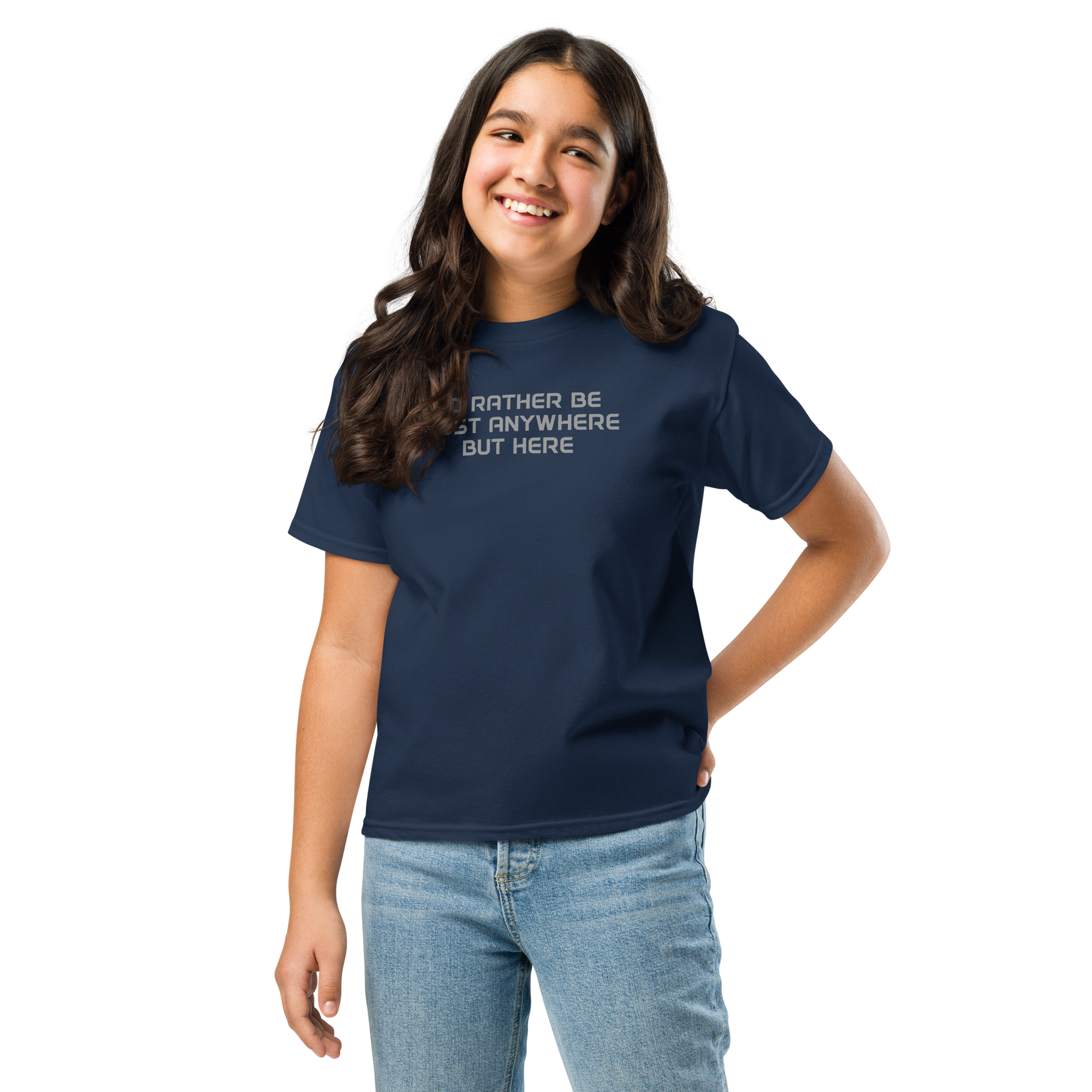 "I’d rather be most anywhere but here" printed on a navy youth classic tee worn by a female