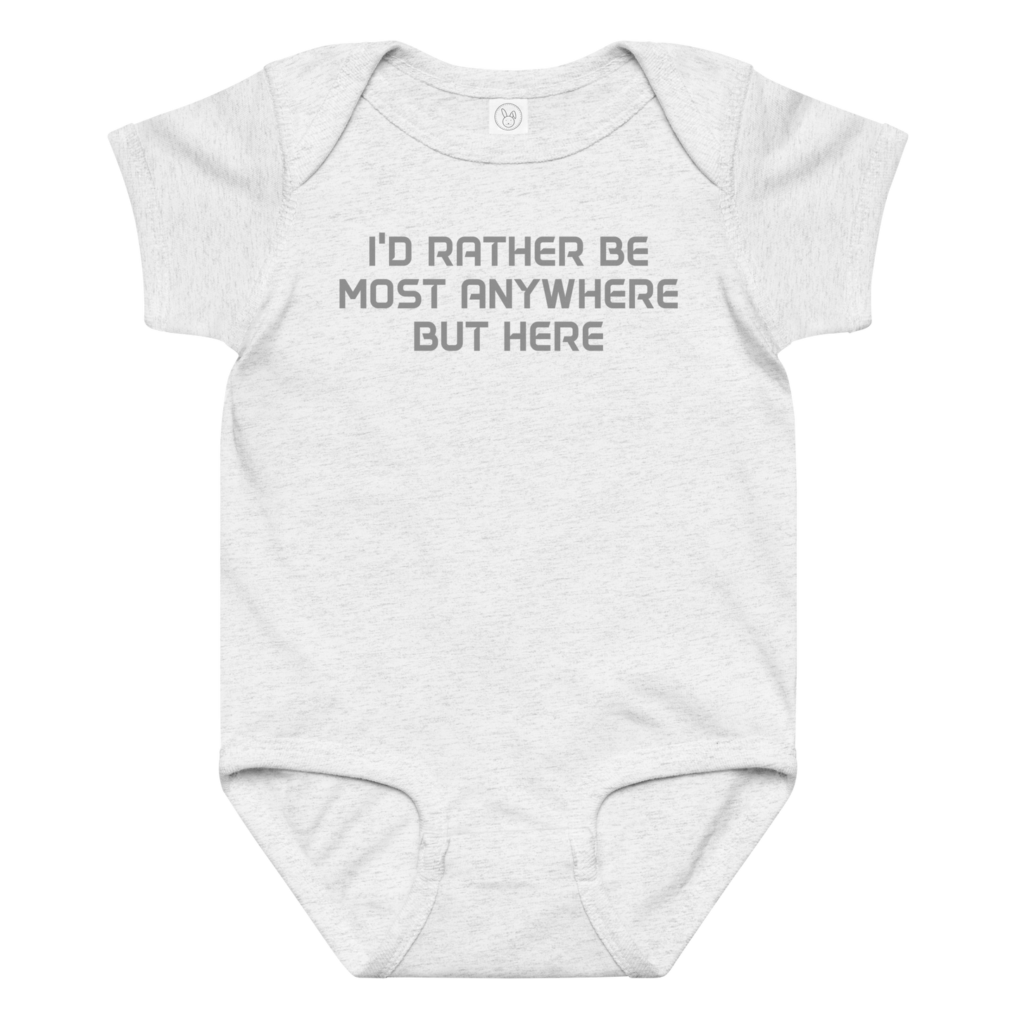 "I’d rather be most anywhere but here" printed on a ash baby jersey bodysuit laying on a flat surface amongst other clothes