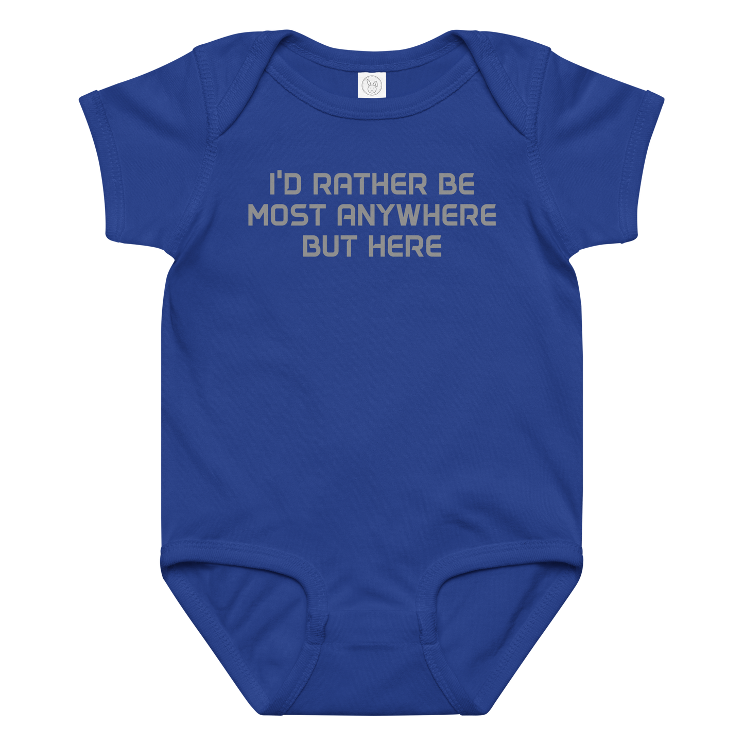 "I’d rather be most anywhere but here" printed on a royal baby jersey bodysuit laying on a flat surface amongst other clothes