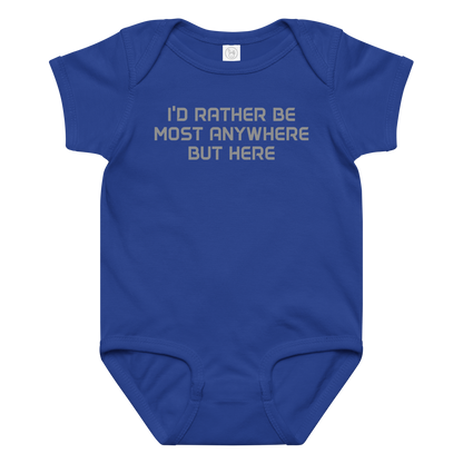 "I’d rather be most anywhere but here" printed on a royal baby jersey bodysuit laying on a flat surface amongst other clothes