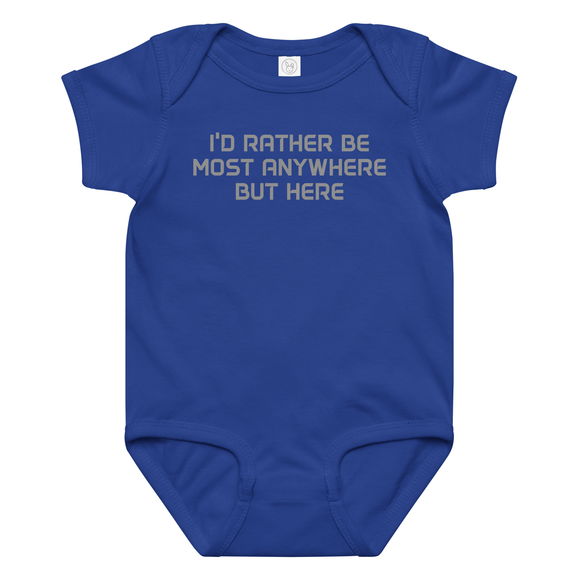 "I’d rather be most anywhere but here" printed on a royal baby jersey bodysuit laying on a flat surface amongst other clothes