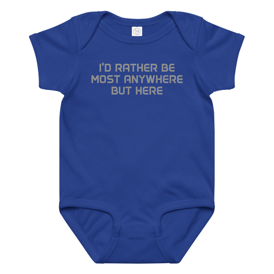 "I’d rather be most anywhere but here" printed on a royal baby jersey bodysuit laying on a flat surface amongst other clothes