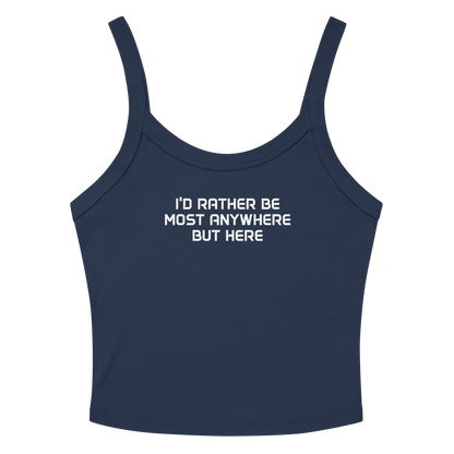 "I’d rather be most anywhere but here" printed on a solid navy blend women's micro-rib tanktop laying on a flat surface amongst sunglasses and shorts