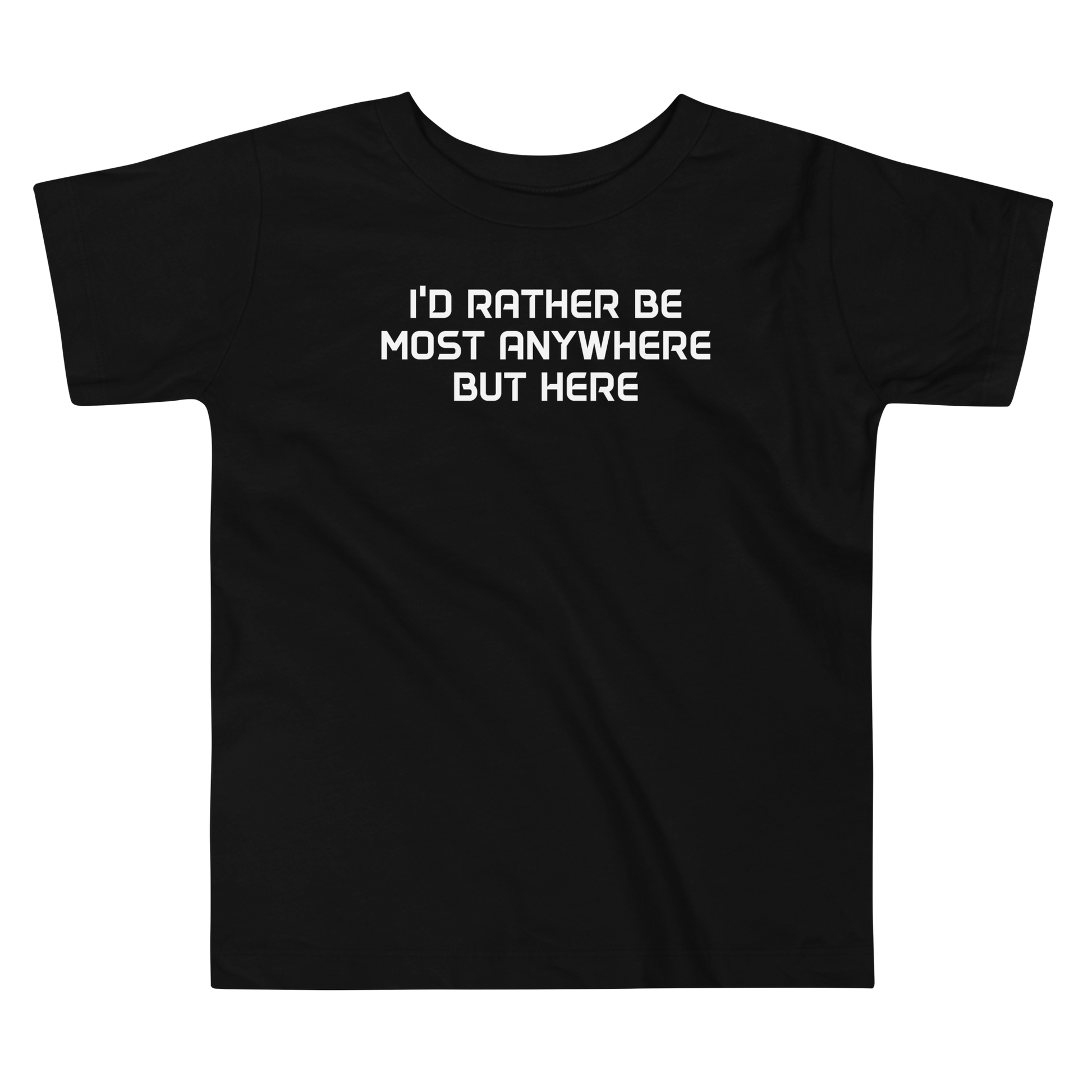 "I’d rather be most anywhere but here" printed on a black toddler short sleeve tee laying on a flat surface