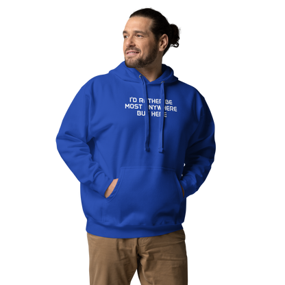 "I’d rather be most anywhere but here" printed on a team royal unisex hoodie worn by a male