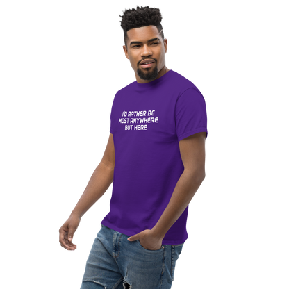 "I’d rather be most anywhere but here" printed on a purple unisex classic tee worn by a male