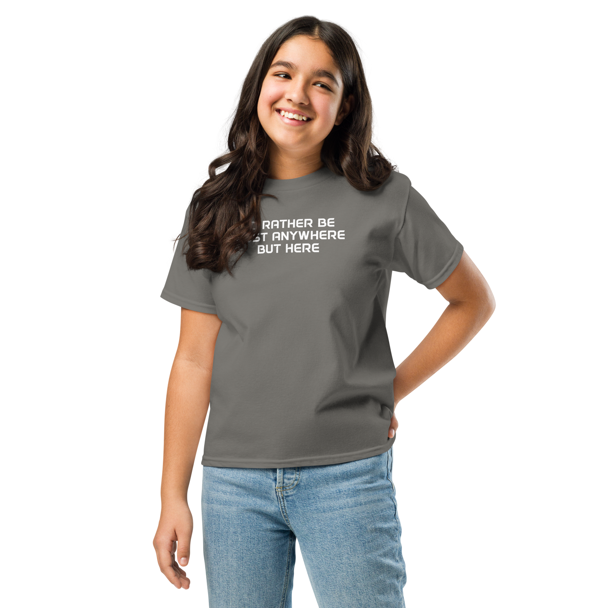 "I’d rather be most anywhere but here" printed on a charcoal youth classic tee worn by a female