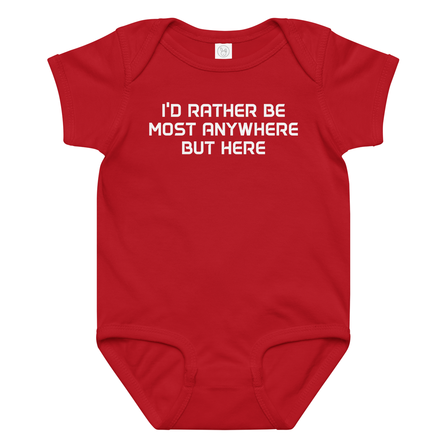 "I’d rather be most anywhere but here" printed on a red baby jersey bodysuit laying on a flat surface amongst other clothes