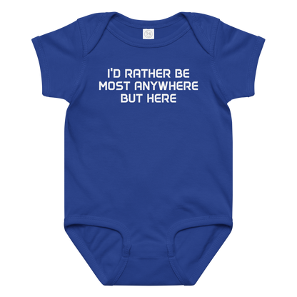 "I’d rather be most anywhere but here" printed on a royal baby jersey bodysuit laying on a flat surface amongst other clothes