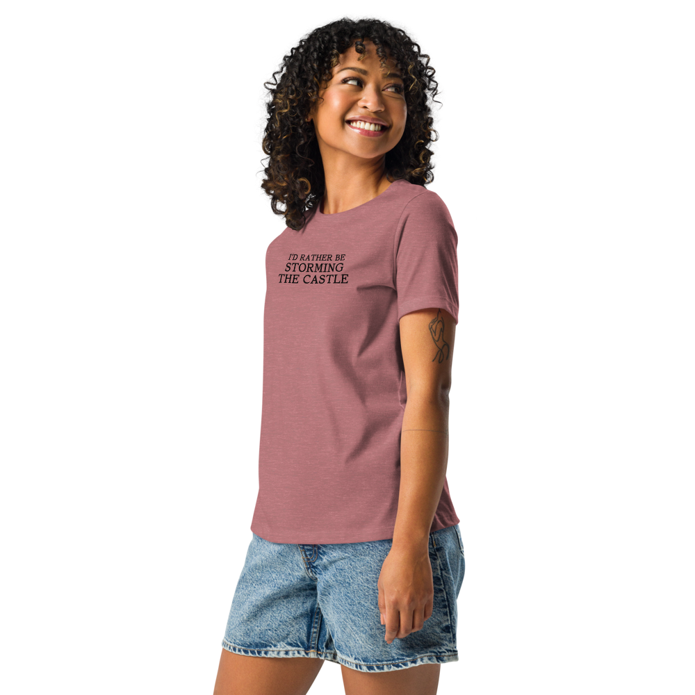 "I'd rather be storming the castle" printed on a heather mauve women's relaxed t-shirt worn by a female