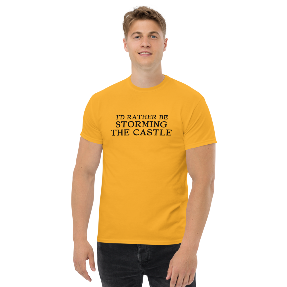 "I'd rather be storming the castle" printed on a gold unisex classic tee worn by a male