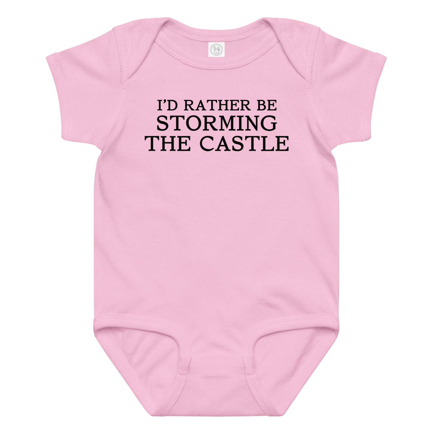 "I'd rather be storming the castle" printed on a pink baby jersey bodysuit laying on a flat surface amongst other clothes