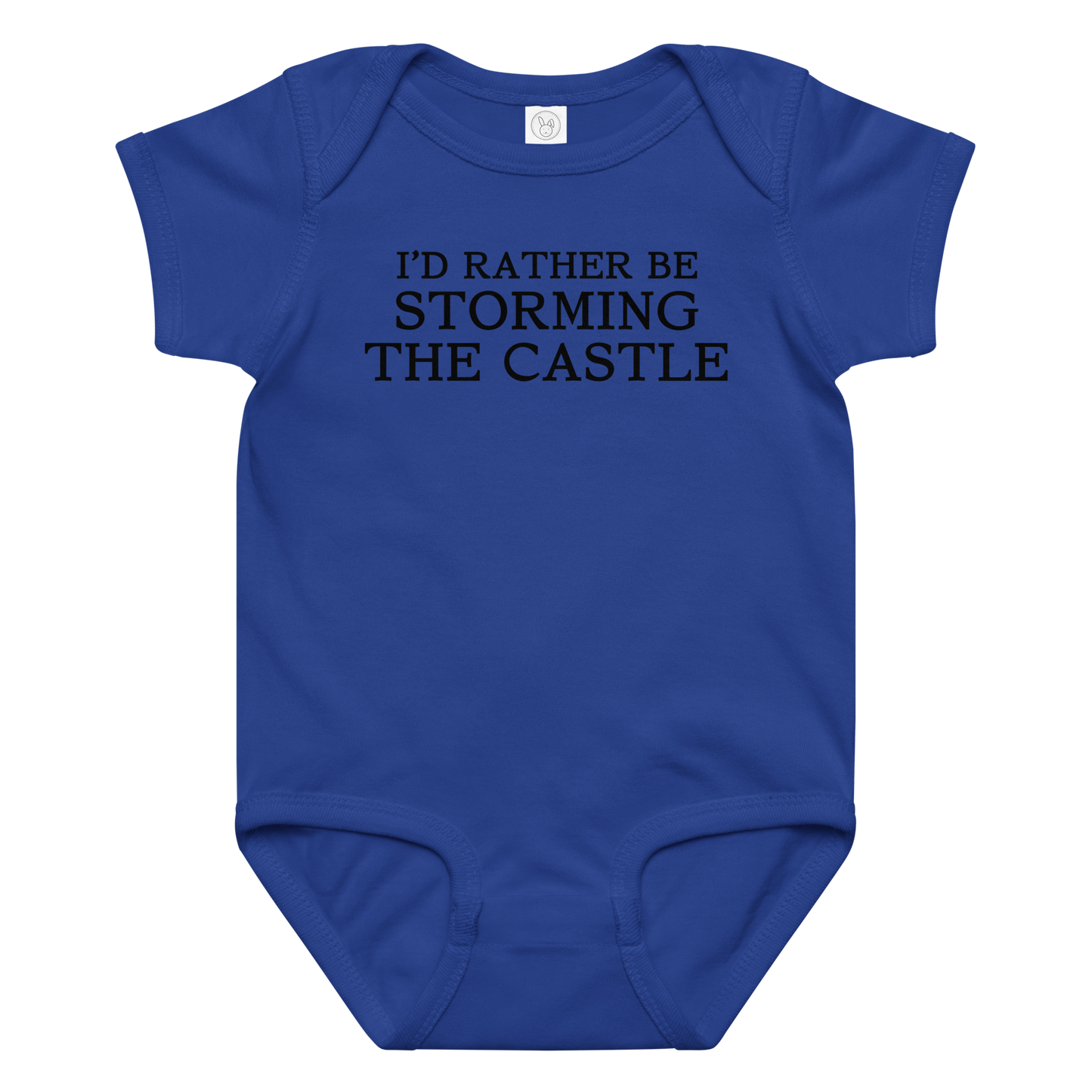 "I'd rather be storming the castle" printed on a royal baby jersey bodysuit laying on a flat surface amongst other clothes
