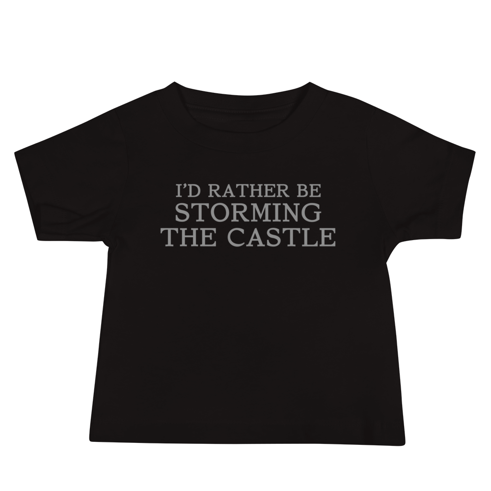 "I'd rather be storming the castle" printed on a black baby jersey short sleeve tee laying on a flat surface