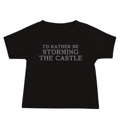 "I'd rather be storming the castle" printed on a black baby jersey short sleeve tee laying on a flat surface