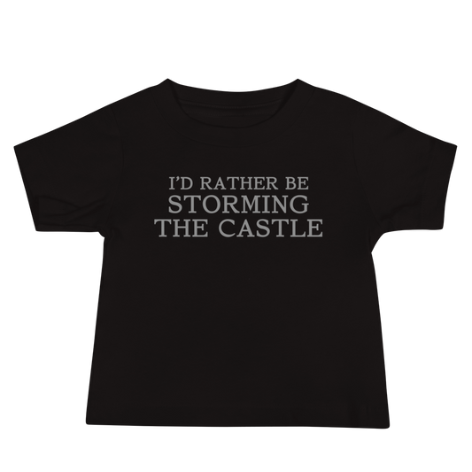 "I'd rather be storming the castle" printed on a black baby jersey short sleeve tee laying on a flat surface