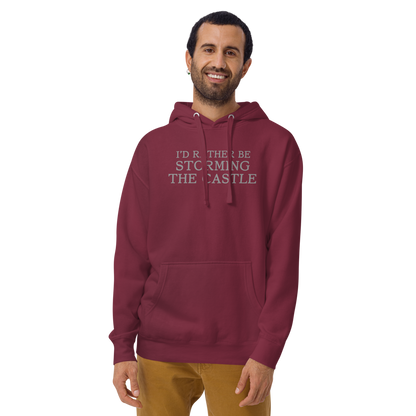 "I'd rather be storming the castle" printed on a maroon warn by a male