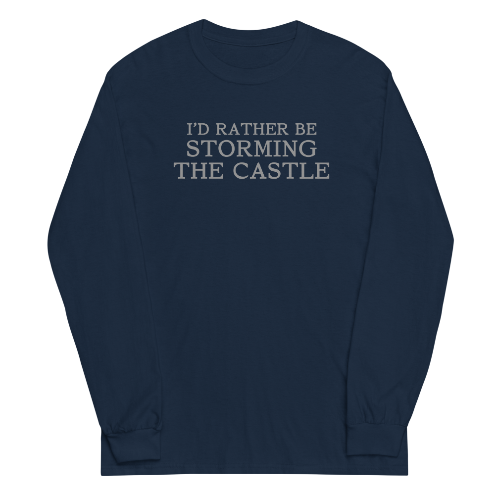 "I'd rather be storming the castle" printed on a navy men's long sleeve shirt laying on a flat surface