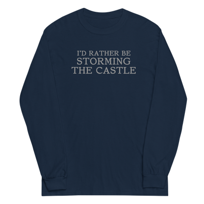 "I'd rather be storming the castle" printed on a navy men's long sleeve shirt laying on a flat surface