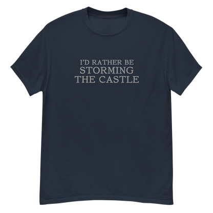 "I'd rather be storming the castle" printed on a navy unisex classic tee laying on a flat surface