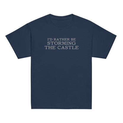 "I'd rather be storming the castle" printed on a navy youth classic tee laying on a flat surface