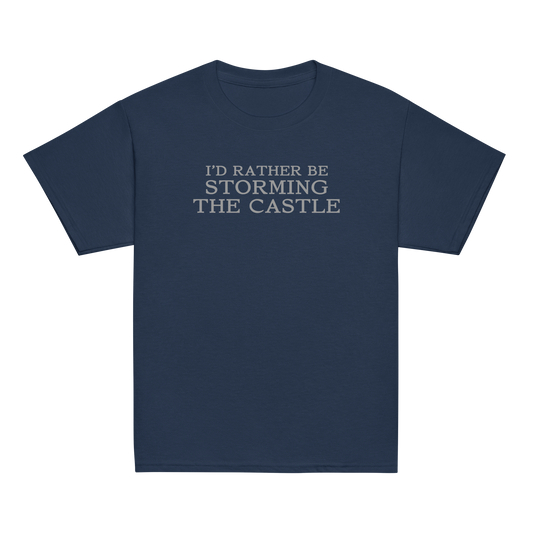 "I'd rather be storming the castle" printed on a navy youth classic tee laying on a flat surface