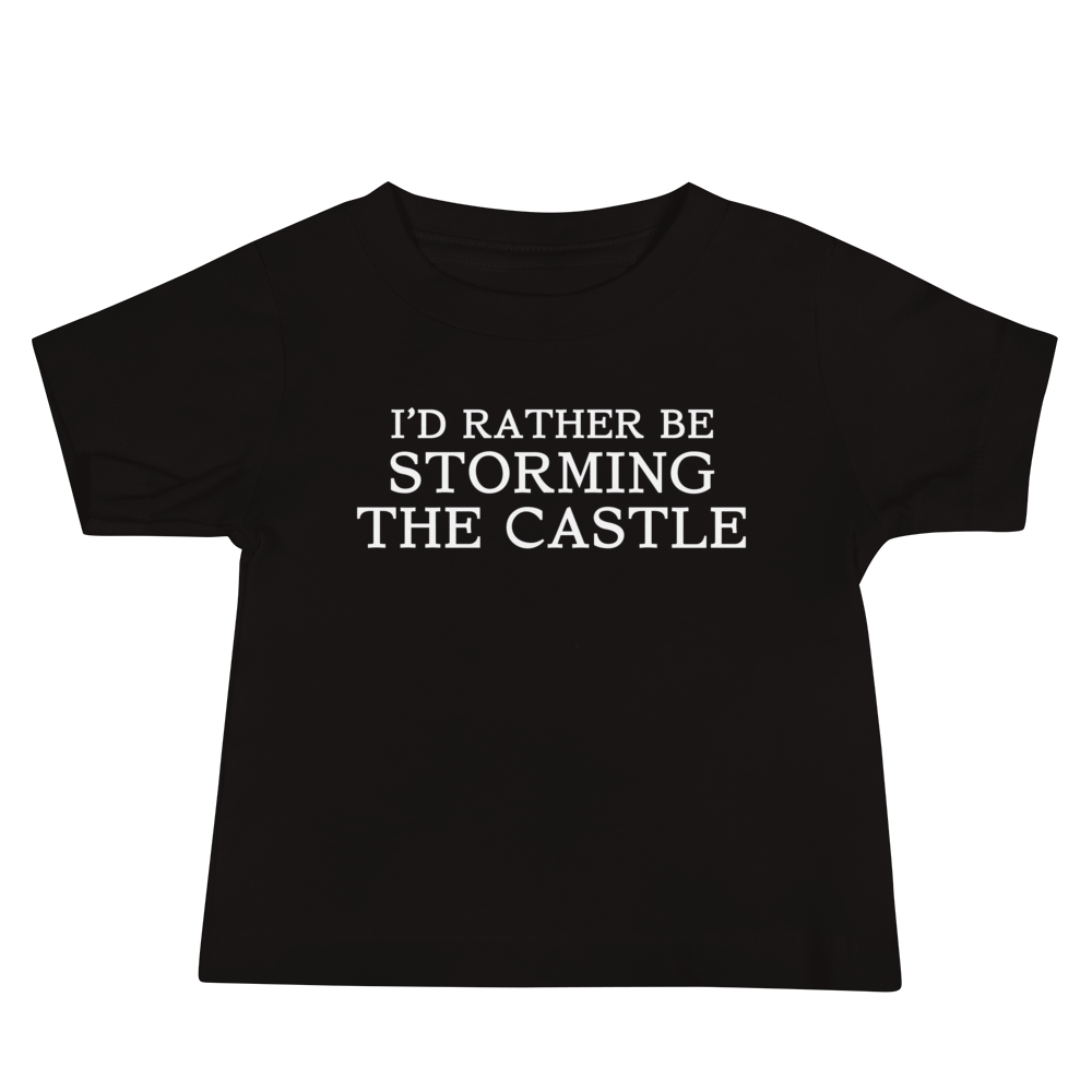 "I'd rather be storming the castle" printed on a black baby jersey short sleeve tee laying on a flat surface