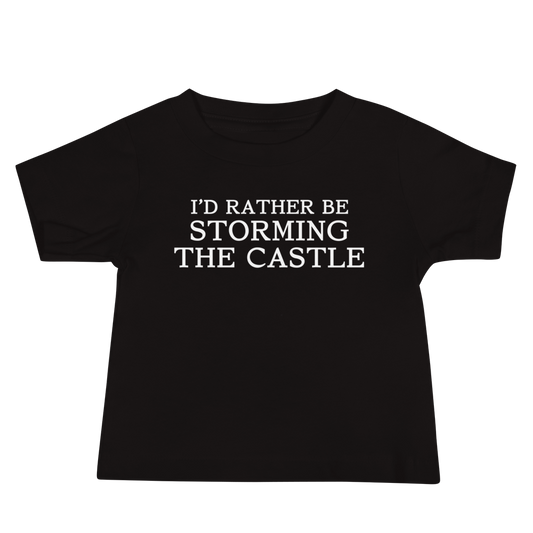 "I'd rather be storming the castle" printed on a black baby jersey short sleeve tee laying on a flat surface
