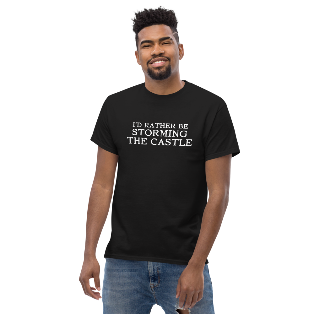 "I'd rather be storming the castle" printed on a black unisex classic tee worn by a male