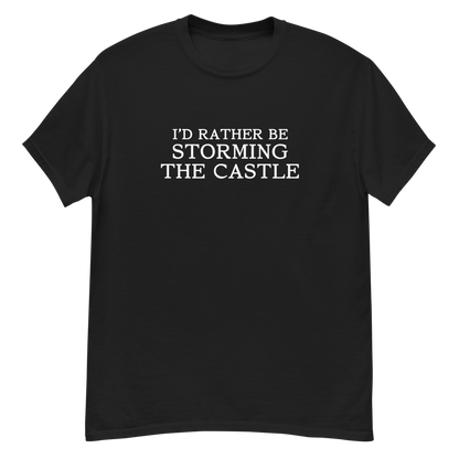 "I'd rather be storming the castle" printed on a black unisex classic tee laying on a flat surface