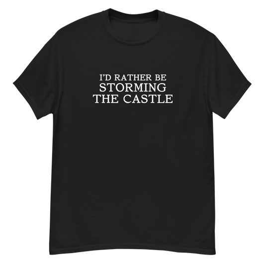 "I'd rather be storming the castle" printed on a black unisex classic tee laying on a flat surface