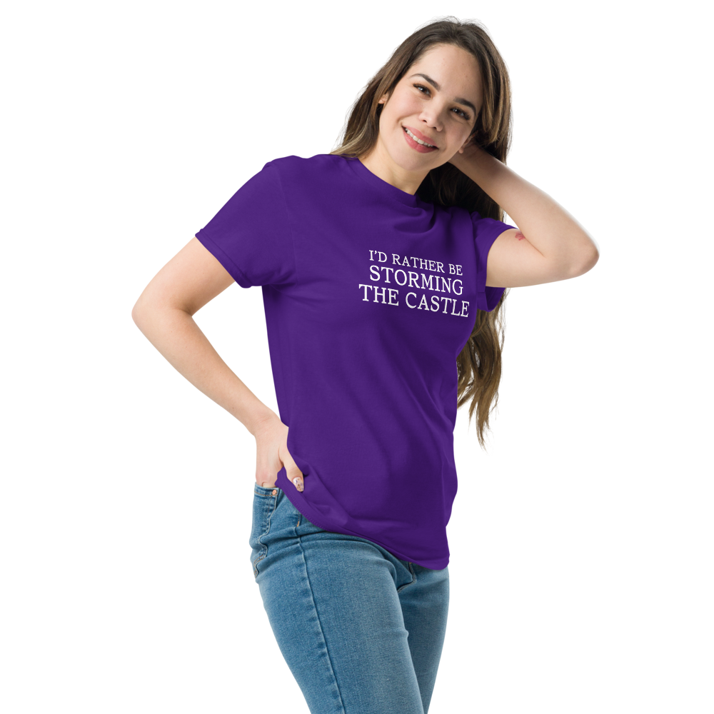 "I'd rather be storming the castle" printed on a purple unisex classic tee worn by a female