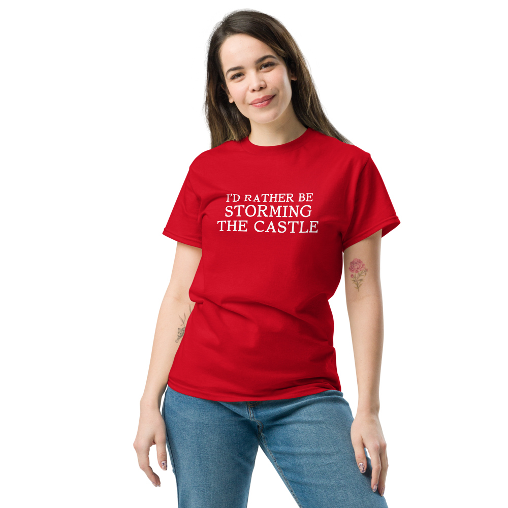 "I'd rather be storming the castle" printed on a red unisex classic tee worn by a female