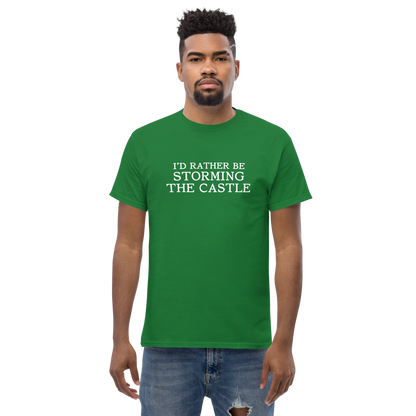"I'd rather be storming the castle" printed on a turf green unisex classic tee worn by a male