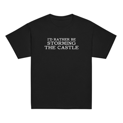 "I'd rather be storming the castle" printed on a black youth classic tee laying on a flat surface