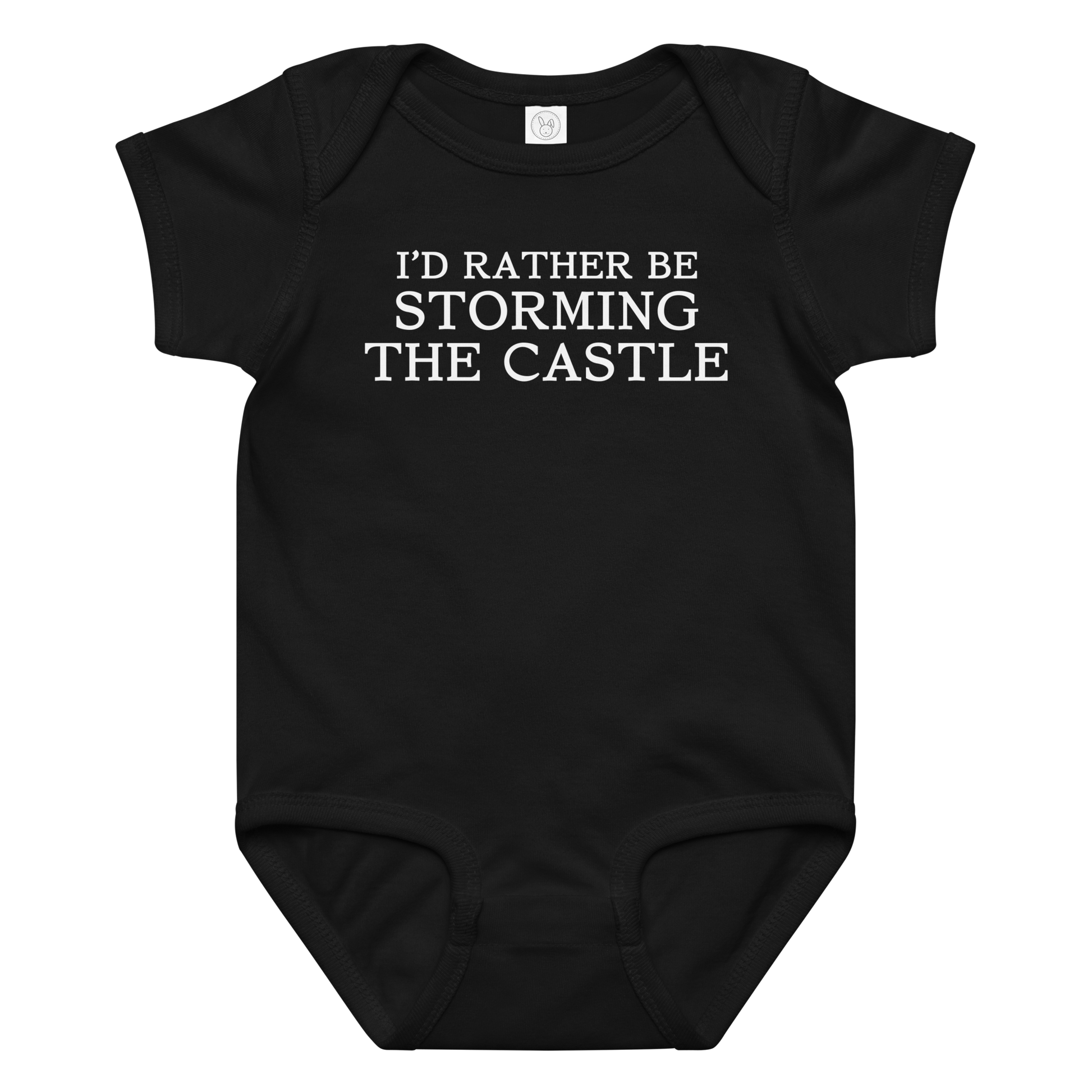 "I'd rather be storming the castle" printed on a black baby jersey bodysuit laying on a flat surface amongst other clothes