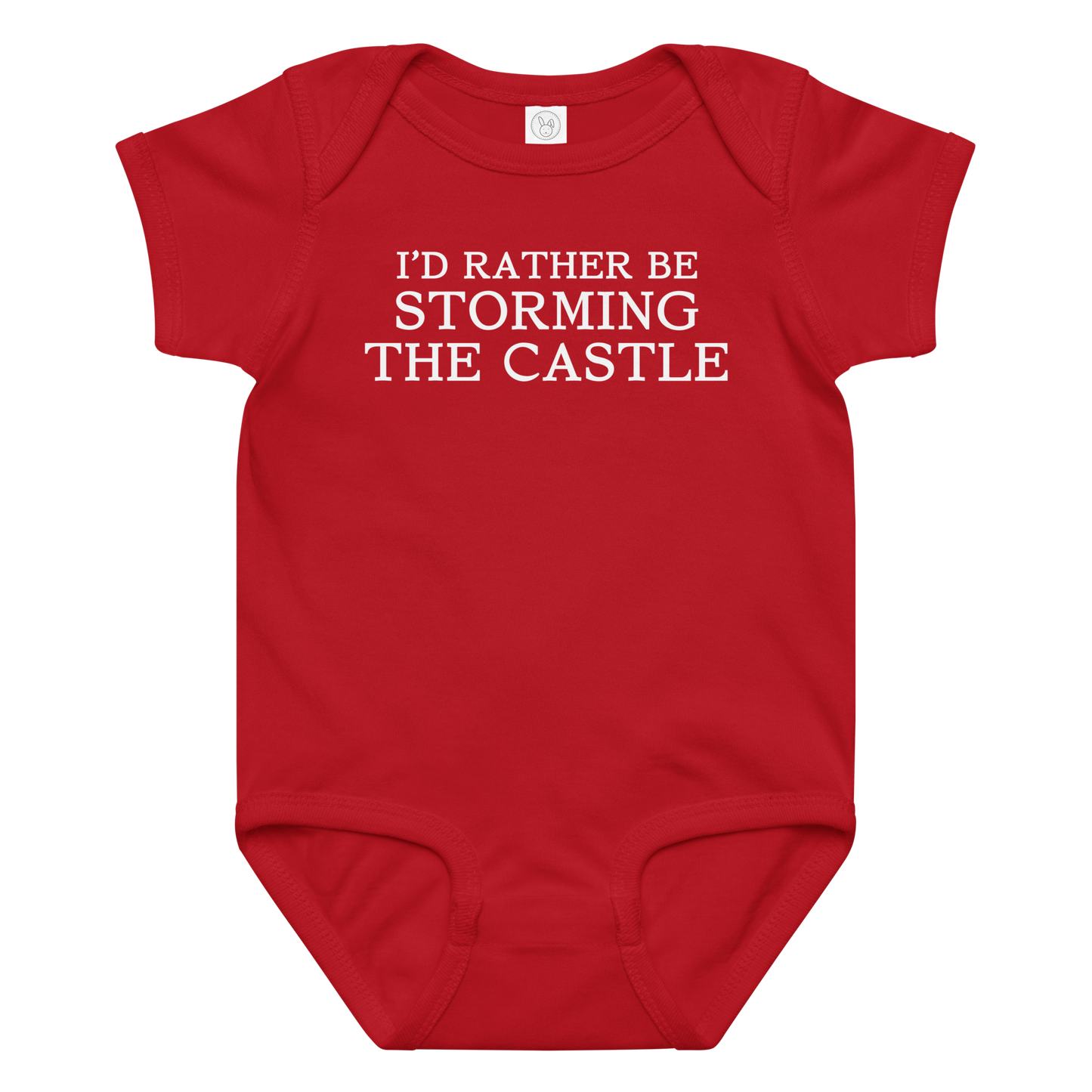 "I'd rather be storming the castle" printed on a red baby jersey bodysuit laying on a flat surface amongst other clothes