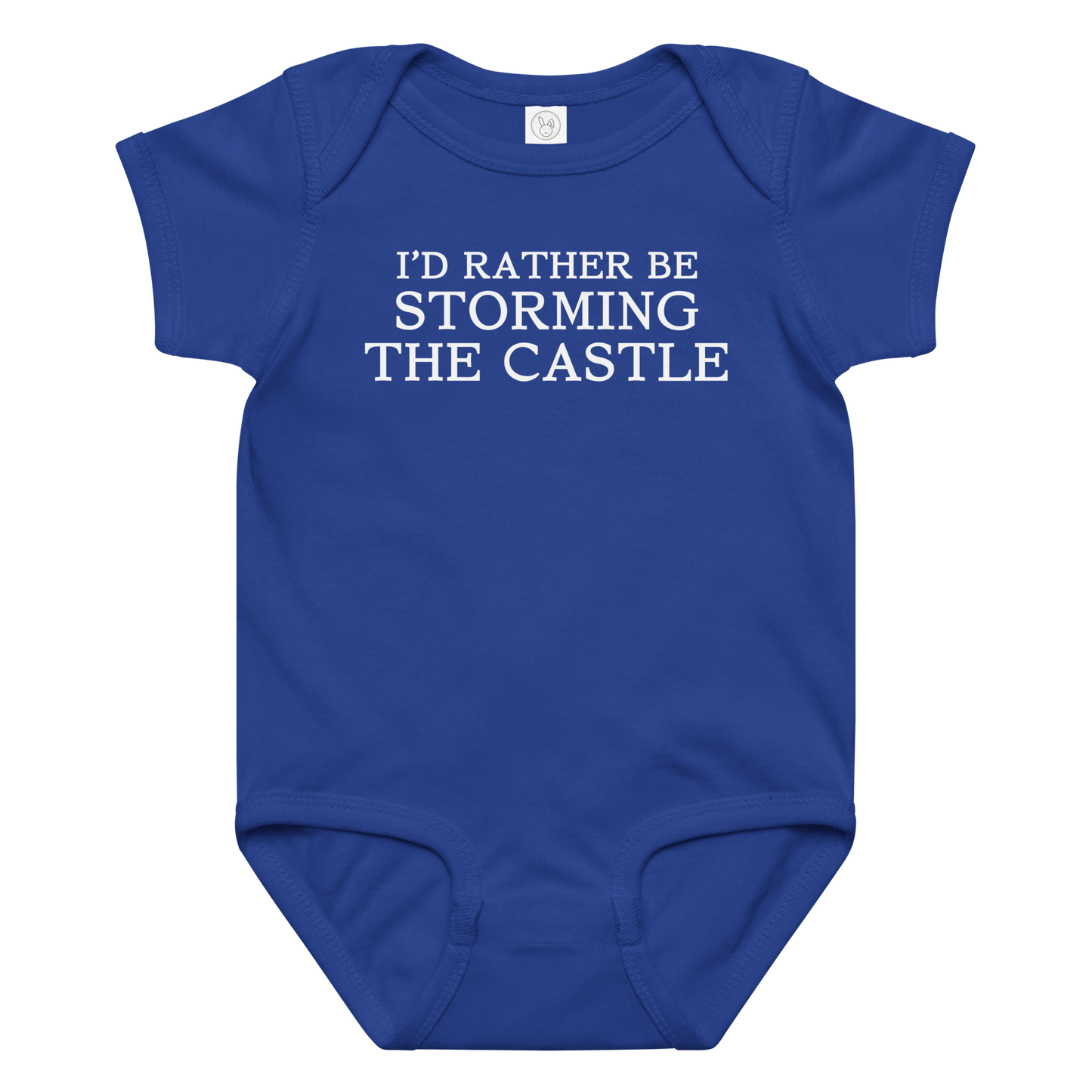 "I'd rather be storming the castle" printed on a royal baby jersey bodysuit laying on a flat surface amongst other clothes