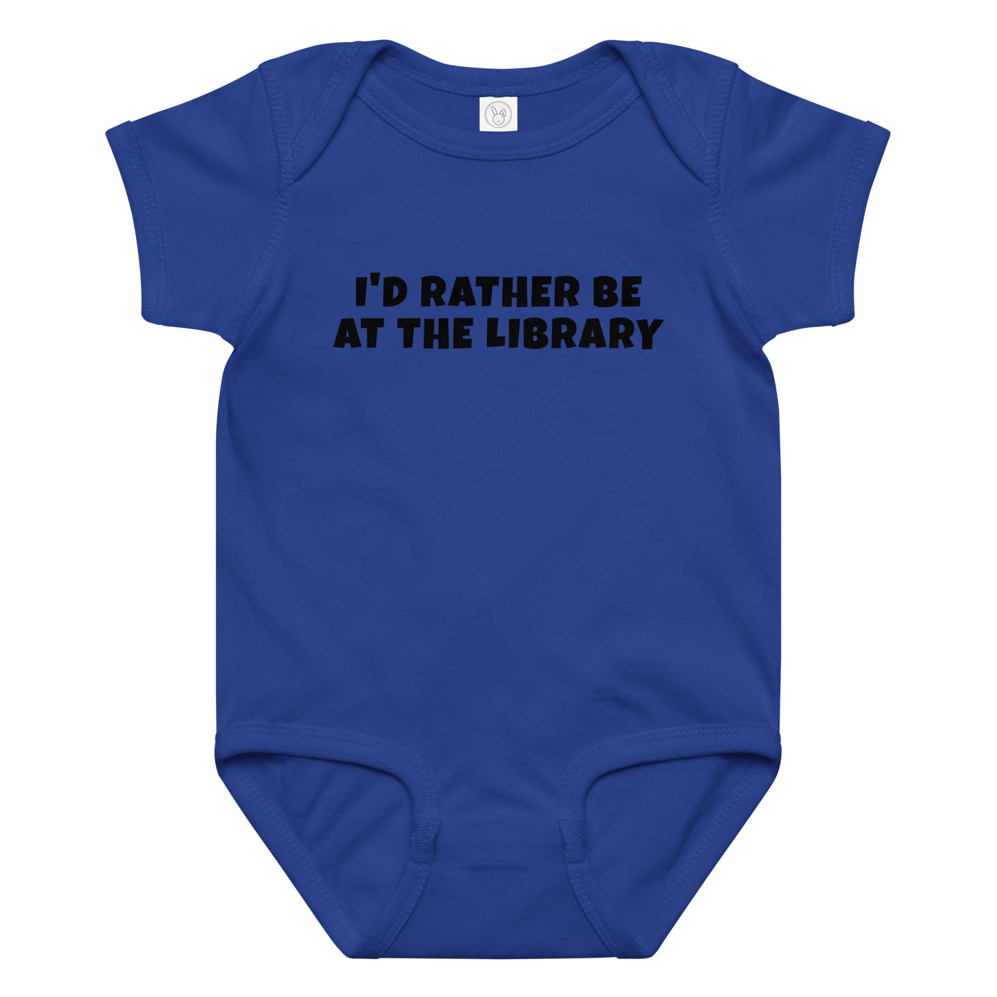 "I’d rather be at the library" printed on a royal baby jersey bodysuit laying on a flat surface amongst other clothes