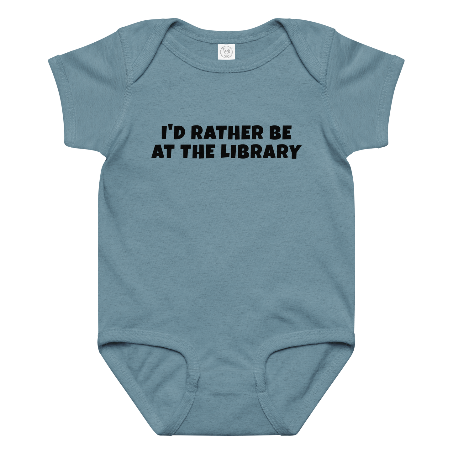 "I’d rather be at the library" printed on a vintage indigo baby jersey bodysuit laying on a flat surface amongst other clothes