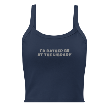 "I’d rather be at the library" printed on a solid navy blend women's micro-rib tanktop laying on a flat surface