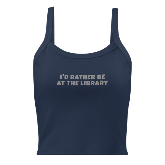 "I’d rather be at the library" printed on a solid navy blend women's micro-rib tanktop laying on a flat surface
