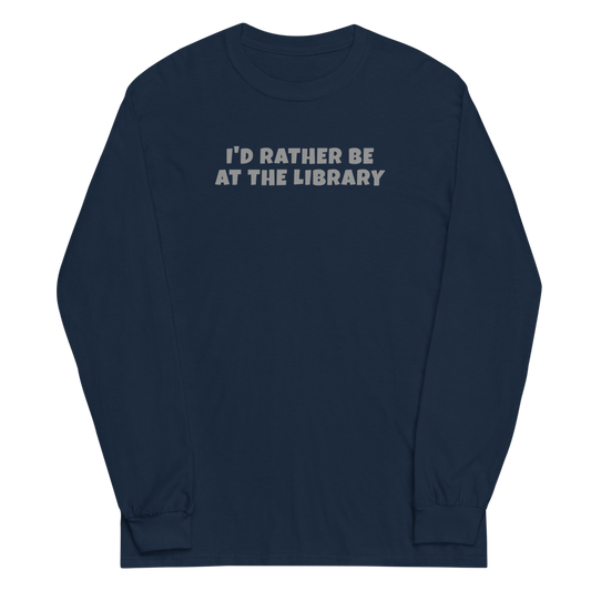 "I’d rather be at the library" printed on a navy men's long sleeve shirt laying on a flat surface