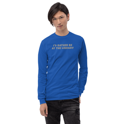 "I’d rather be at the library" printed on a royal men's long sleeve shirt worn by a male