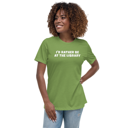 "I’d rather be at the library" printed on a leaf women's relaxed t-shirt worn by a female