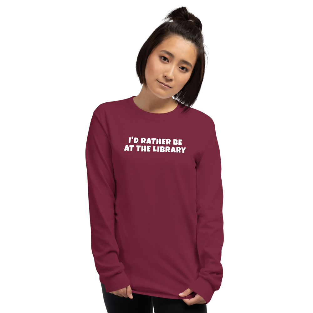 "I’d rather be at the library" printed on a maroon men's long sleeve shirt worn by a female