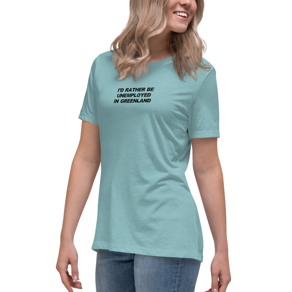 "I'd rather be unemployed in greenland" printed on a heather blue lagoon women's relaxed t-shirt worn by a female