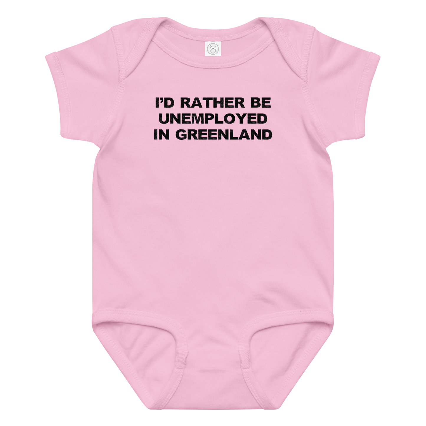"I'd rather be unemployed in greenland" printed on a pink baby jersey bodysuit laying on a flat surface amongst other clothes